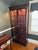 Stunning vintage mahogany curio cabinet attributed to Hickory Chair. The curio cabinet is lit with plug in cord, has...