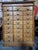 An American tiger oak file cabinet with 24 individual drawers. Circa. 1900. Retains makers label "Shannon Filing Cabinet"....