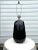 The vintage 1980's Art Deco style lamp reflects a glossy sheen on the heavy embossed black ceramic base. This fixture is...