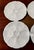 Here is a set of four bright-white porcelain oyster plates--made in France for DANSK INTERNATIONAL DESIGNS LTD. Each plate...
