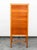 Beautiful tall chest of drawers in cherry wood with metal pulls. Comes with 7 drawers and an x-base frame. Unmarked example.