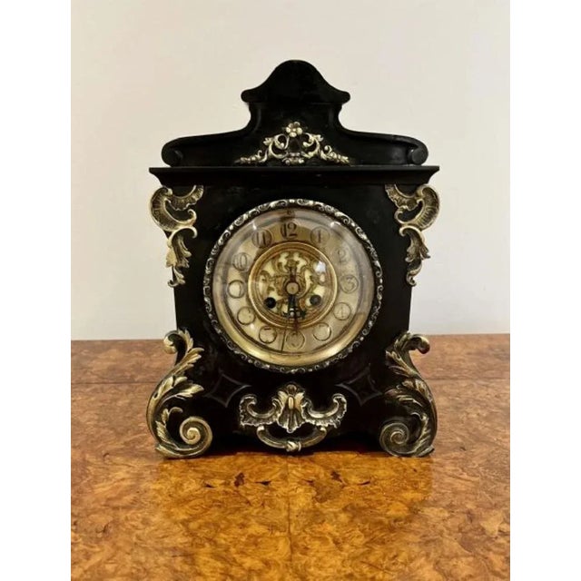 Antique Victorian quality marble eight day mantle clock having a quality black marble mantle clock with ornate gilded...
