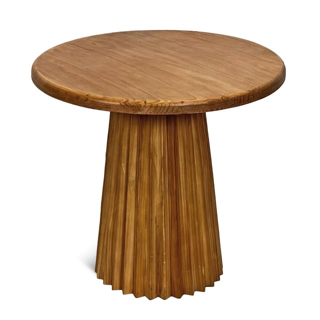 Round natural pine wood side table with fluted pedestal base. This piece will work beautifully in a variety of interior...