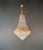 A well balanced basket chandelier that stands out not through excess, but through proportion and quiet elegance. This...