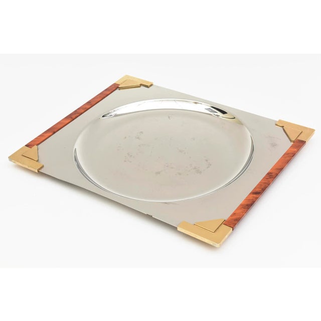 This very chic french signed tray is a copulation of gold plated brass, stainless steel and burled wood. It is signed Guy...