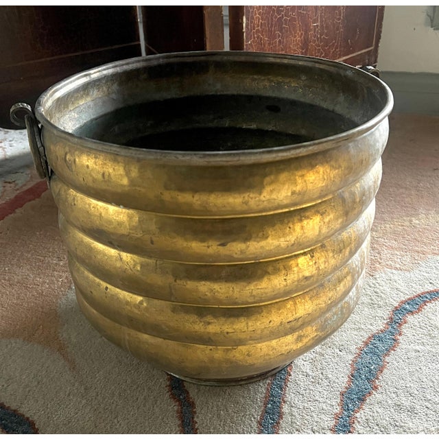 A unique solid brass planter or Jardiniere.. The piece has a wonderful patinated brass finish and is ribbed from top to...