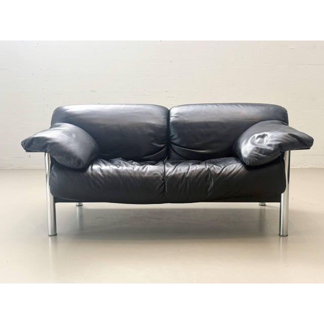 Iconic two-seater sofa, model *pause*, designed by pierluigi cerri for poltrona frau. This 1990s design combines generous...