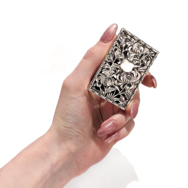 A fine antique Chinese silver export matchbox cover. By Hung Chong of Canton & Shanghai. With openwork chrysanthemums and...