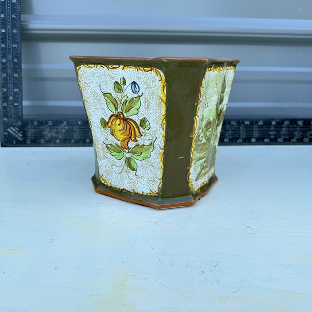 This unique mid-century ceramic planter, crafted in Italy, showcases a hexagonal shape that combines both traditional and...