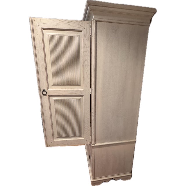 Lexington Solgarden entertainment armoire - cut out back & hole for electronics. Wrap doors. Inner cable and power outlet.