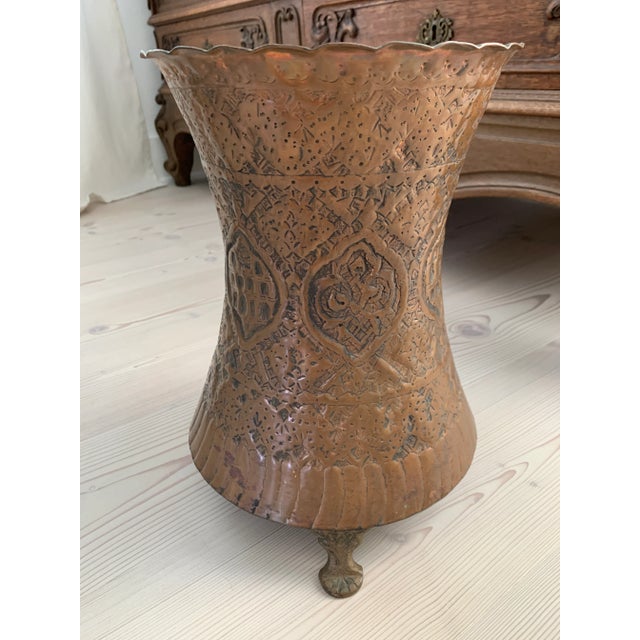 Here we have a great old footed Middle Eastern shapely copper vessel. Perfect for that exotic Bohemian texture. LOTS of...