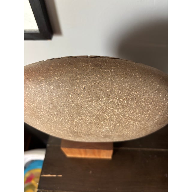 This is a beautiful Mid Century modern J. Edward Barker statue. A wonderful carved sun face affixed to a teak block. An...