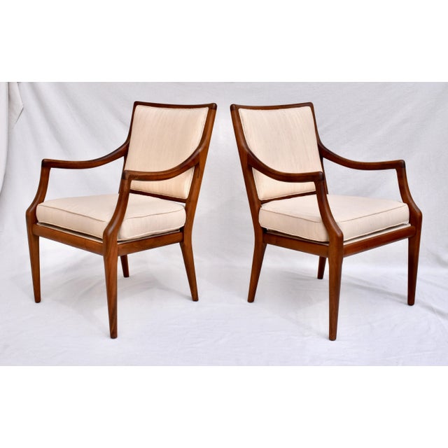 Pair of 1950's mid Century Modern solid walnut armchairs with interesting swag arms, subtle tapered legs & all original...