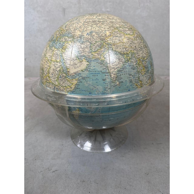 Vintage National Geographic globe from 1961 with acrylic glass stand. The paper/cardboard globe can be removed from the...