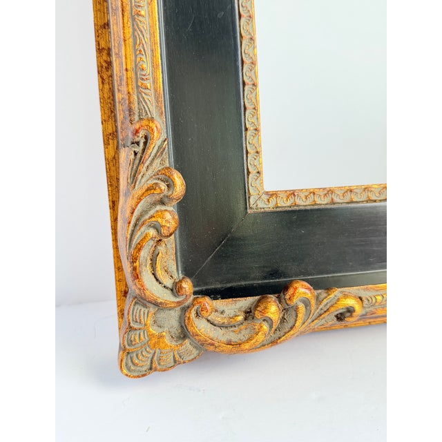 A handsome carved frame in dark antique gold with a black panel inset, made for 8x10 photos or canvases. The wide molding...