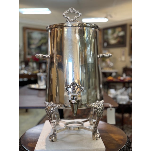 An absolutely gorgeous, substantial vintage coffee urn or beverage dispenser featuring silver-plated/silver-soldered...