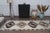 Elevate your hallway, entry, or gallery space with this authentic 1960s vintage handwoven wool runner rug. Woven with a...