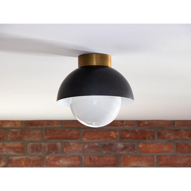 Our Montreux Flush Mount has a beautiful, minimalistic silhouette with its metal shade and large, the milk glass globe...