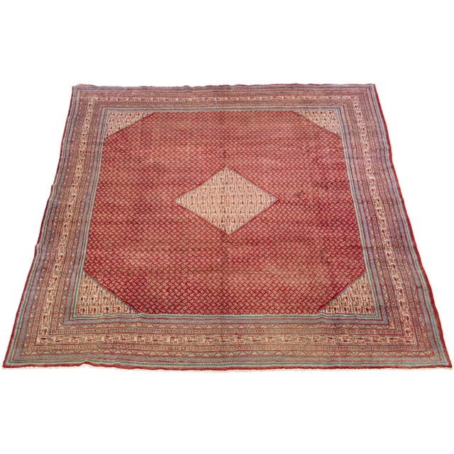 Beautiful Hand-knotted Mahal Wool rug with the red field has beige, green, and blue accents all over the geometric...