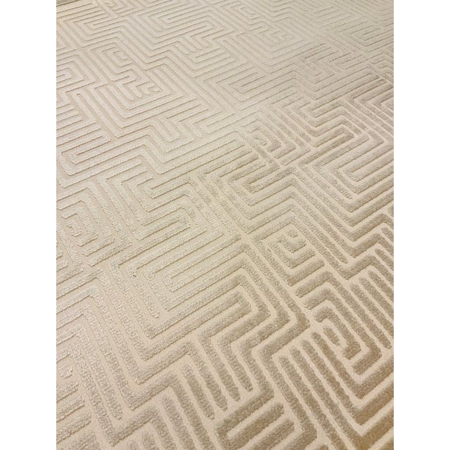 This Schumacher fabric is neutral and versatile with a key design and a khaki and pearl colorway. It is a multipurpose...