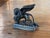 19th century English patinated white metal herald lion striding forward with wings raised, one forepaw on a book, head...