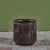 A cylindrical stoneware planter from Robert Maxwell and David Cressey's 1970s collaboration Earthgender. The planter has a...