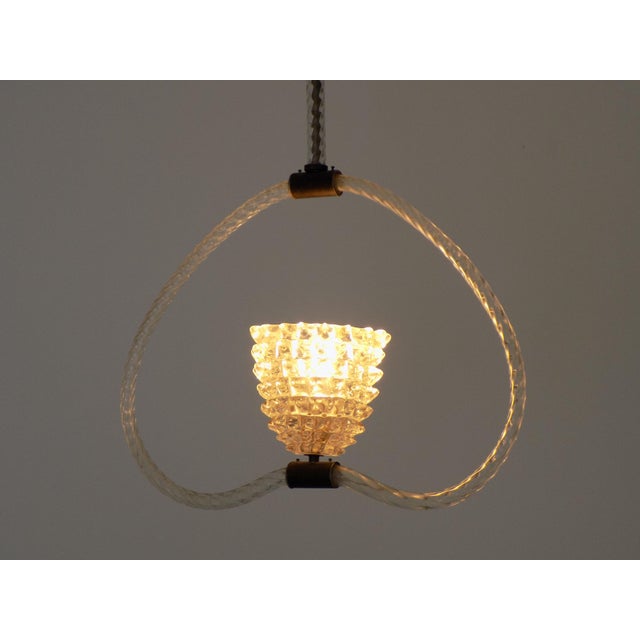 Pendant lamp Bulicante glass structure, brass details. This piece is attributed to the mentioned designer/maker. It has no...