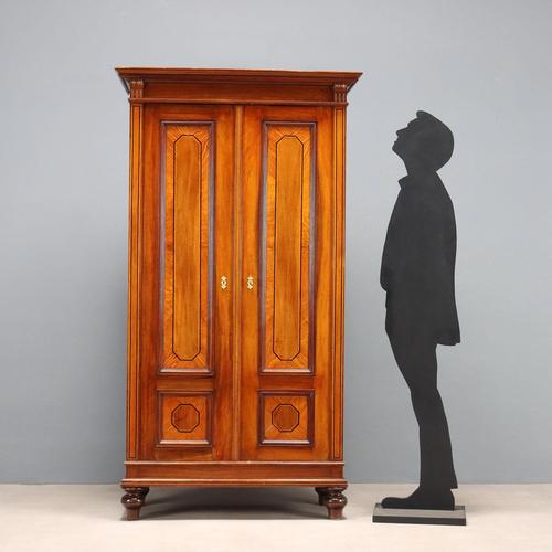 Mahogany veneered wardrobe. Paneled front doors with ebony and maple trim and oak inserts. Onion legs, fir interior....