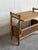 Beautiful vintage Danish side table crafted in oak with an integrated woven cane magazine rack. The piece features...