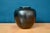 This lovely spherical vase is a product of the Elchinger pottery. Its simple form is highlighted by the famous black...