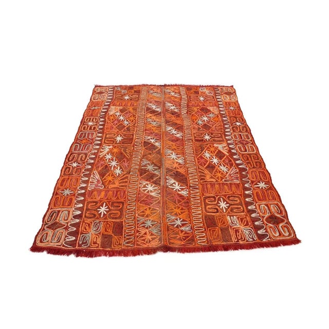 Decorative handwoven embroidered vintage kilim rug from Iraq. Approximately 50-60 years old. In very good condition.