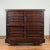 A Japanese Meiji period merchant's chest from the late 19th century, with wheels, sliding doors and dark patina. Created...