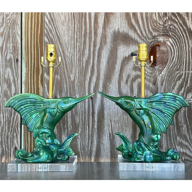 Illuminate your space with these vintage coastal Royal Haeger sailfish lamps. Featuring sleek, sculpted sailfish designs,...