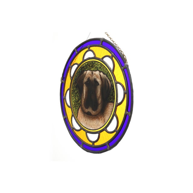 A characterful Belgian Art Deco stained‑glass roundel from around 1900, centred with a lifelike portrait of an English...