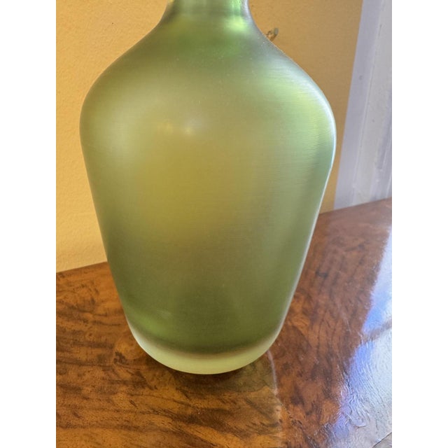 Venini bottle made of Murano glass, green Height: 26 cm, Diameter: 16 cm In good, used condition This piece has an...