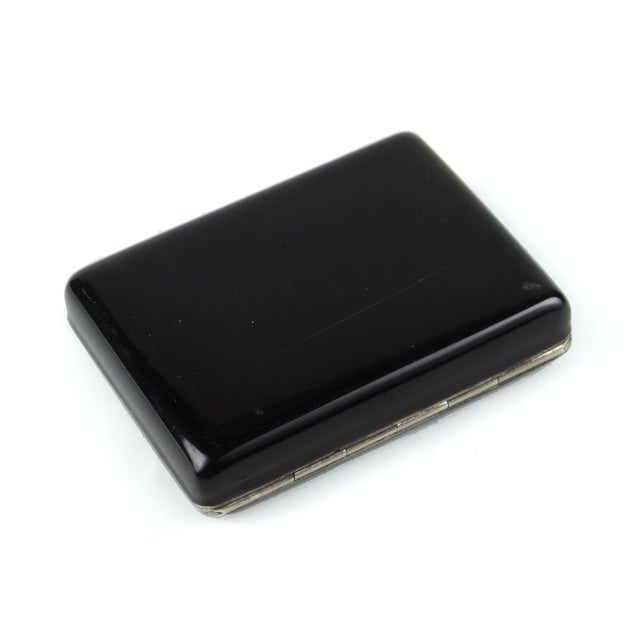 Early 20th century Art Déco metal and black enamel compact vanity case with mirror and lipstick holder, France By: unknown...