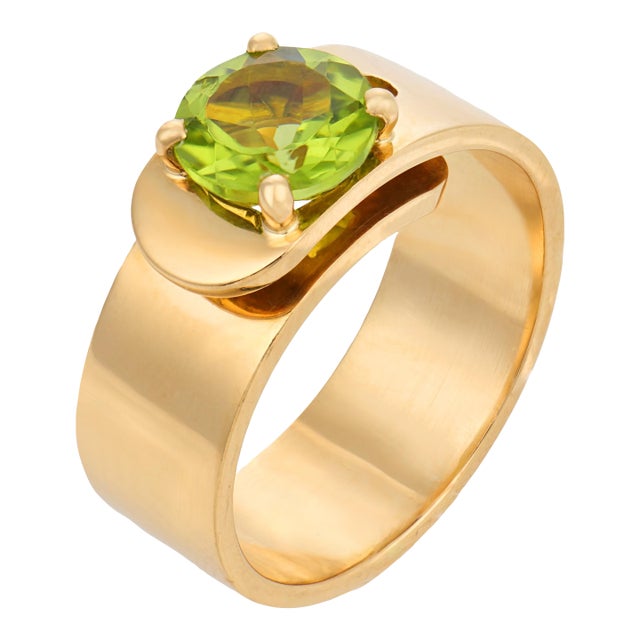 1990s Dinh Van French 1.85 Carat Peridot 18k Yellow Gold Buckle Ring, Size 6.75 For Sale