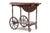 This vintage tea cart features collapsible side wings and a glass serving tray with lace detail. Condition: With expected...