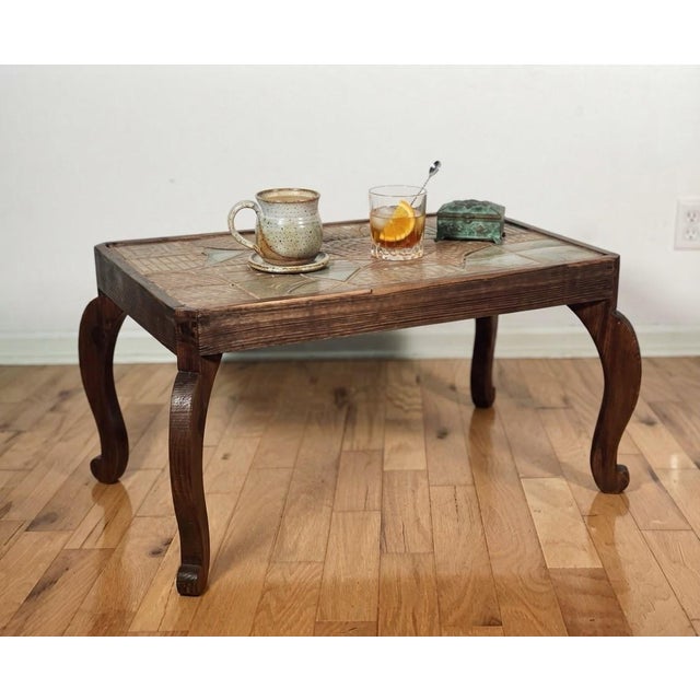 Mid-Century Modern unique vintage accent/cocktail/occasional table with inlaid ceramic tile top set within a sturdy wooden...