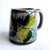 Offered is a vintage late 1970s ceramic gray floral motif mug from Tonalá in Jalisco, Mexico and created by Ken Edwards...