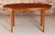 Mid century oval extending teak dining table by mcintosh, circa 1960s. A butterfly extension leaf stored underneath....