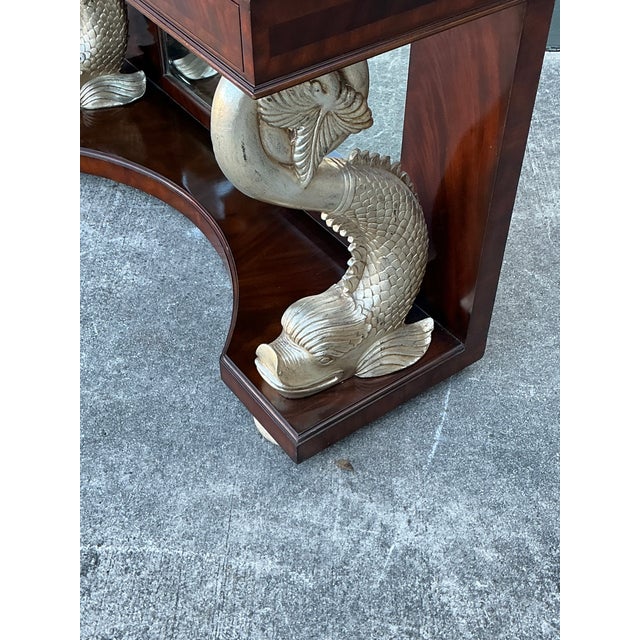 This exquisite console table by Maitland-Smith is a masterclass in Hollywood Regency glamour, featuring the brand's iconic...