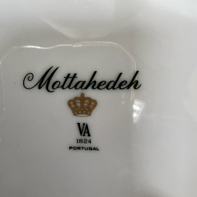 Mottahedeh decorative plate with hand painted cherries design with apricot colored border. Marked made in Portugal.