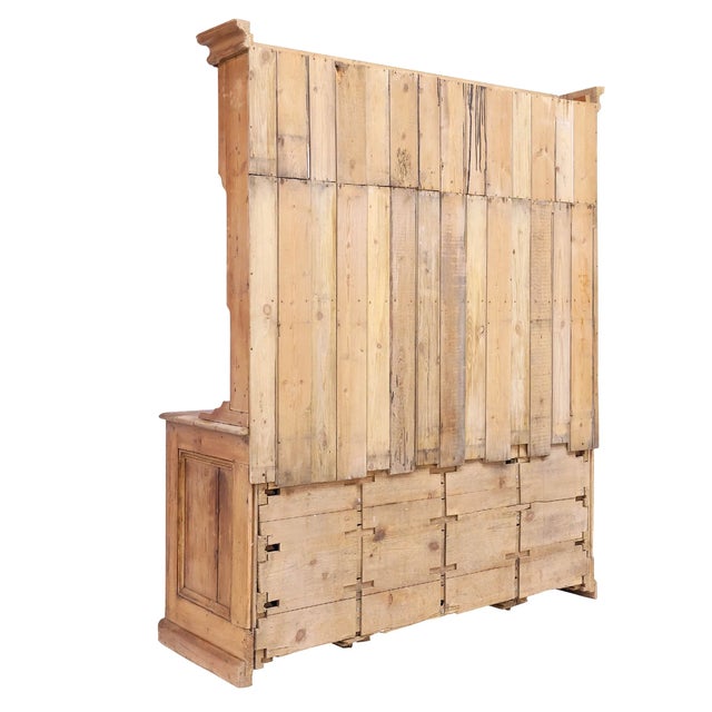 Width: 60.5 inches Height: 76 inches Depth: 22.5 inches A dresser of rare scale and character, this late 19th-century...