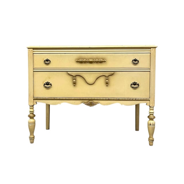 Elegant and full of charm,this French Provincial style dresser features a soft cream-painted finish with delicate...