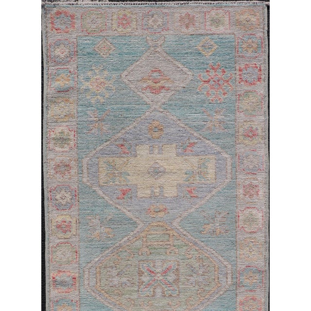 Measures: 2'5 x 6'5 Modern Small Oushak Runner with Teal-Blue Background and Medallion Motif. Keivan Woven Arts; rug...