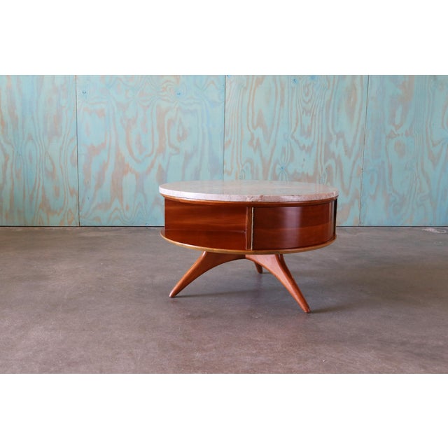 A custom Vladimir Kagan (American, 1927-2016) for Kagan-Dreyfuss, Inc. Marble and cherry rotating round coffee table,...