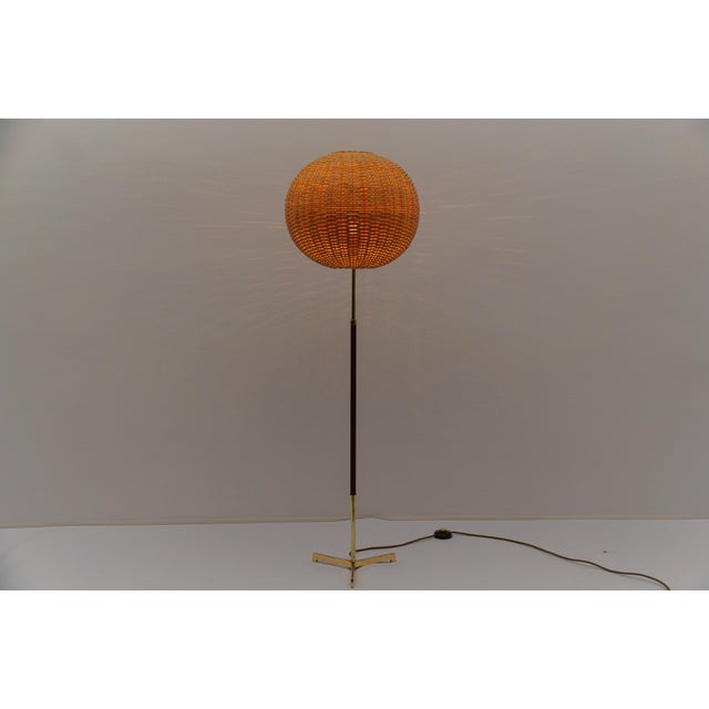Mid-century modern floor lamp in brass and teak from temde, 1960s switzerland executed in brass, metal and teak. The lamp...