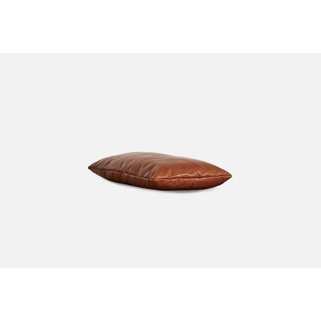 Nought leather level pillow by msds studio materials: camo leather, fabric dimensions: d 23.5 x w 67 x h 8.5 cm the...