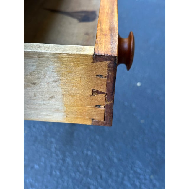 Antique tiger maple stand with graceful hand carved backsplash. This was originally used as a washstand but would be a...